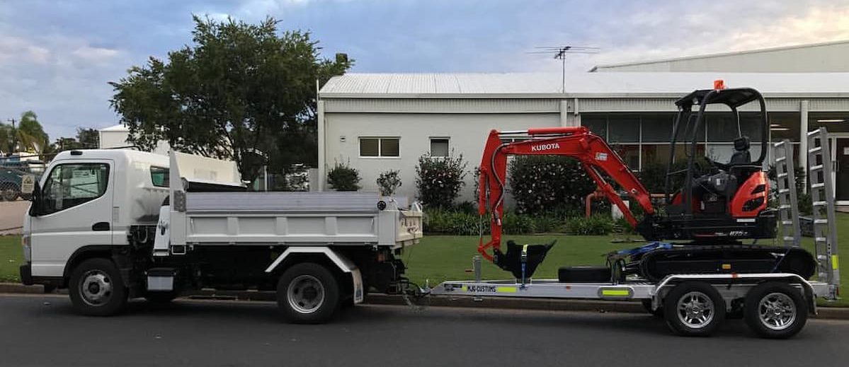 Truck And Excavator — Plumbing & Gas Fitting in Coffs Harbour